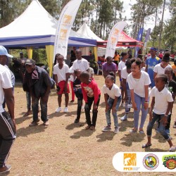 Participants in the recently held Bullhead Ash Wednesday Festival warm up before the walk race to the top of the Bullhead Mountains in Clarendon. warm up